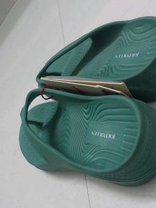 Branded Green flip-flops