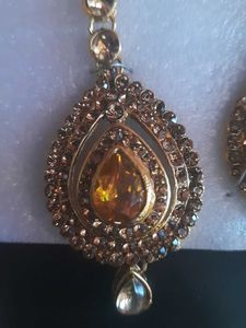 Ornate gold-tone stone earrings