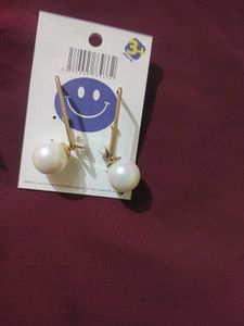 2 pair of gold plated pearl earrings with a stone