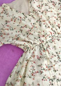 A White Floral Peplum Ruffled Top