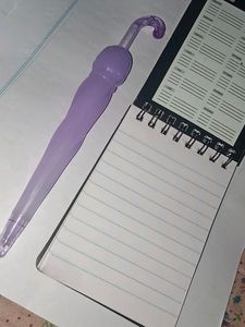 Cute Purple Pen And A Small Notepad..