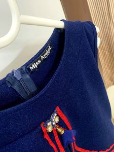 Chic Navy Sleeveless Top with Red Detailing