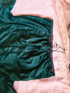 Green hooded windbreaker