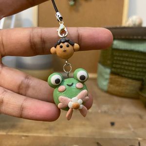 Froggo and a boy clay Charm