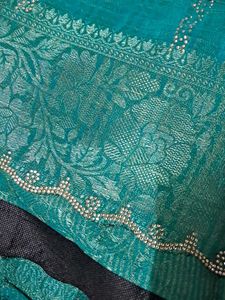 Elegant Teal Saree with Floral Detail