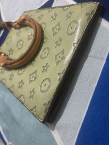 Louie’s Vitton patterned mini handbag