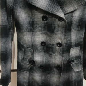 black and grey check mid length coat
