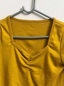 Title:Mustard Yellow Ribbed Lettuce Hem Crop Top