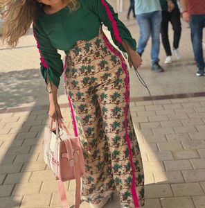 LABEL AYUSHI SHAH BONNING PANTS AND GREEN TOP