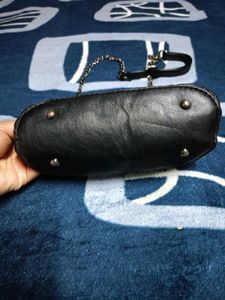 Black Quilted Carrot Sling Bag