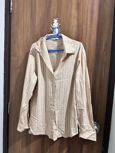 striped light creme shirt.