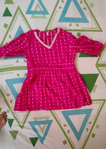 Pink tunic with white details