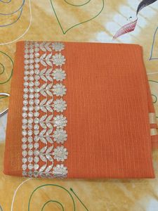 Orange saree with silver embroidery