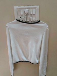 A white cut-out long sleeve crop top