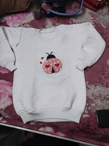 White Sweatshirt With Patchwork.