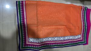 Orange Saree with Colorful Embellishments
