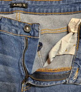 Women&#39;s Blue Jeans with Button Detail