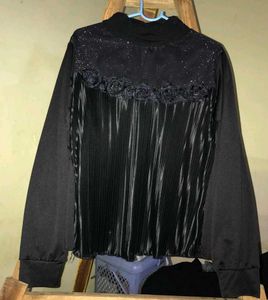Elegant black pleated top.