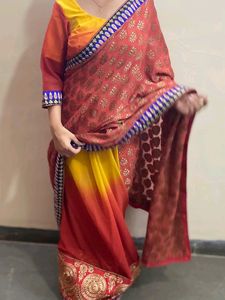 YELLOW ORANGE SHIFFON AND HEAVY EMBROIDERY SAREE