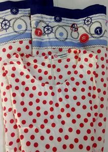 A Beautiful White Frok With Red Polka Dots