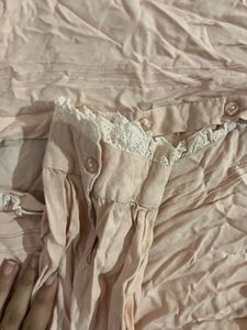 Peach Shirt With Ruffles On Sleeves And Front