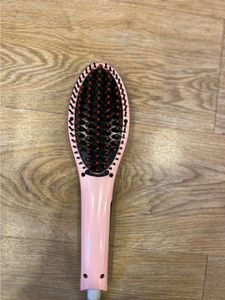 Woman’s hair straightener