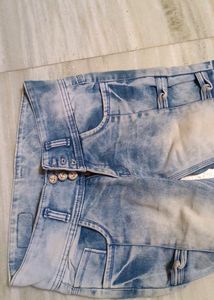 Designer jeans with multiple buttons