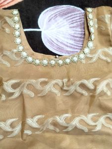 It&#39;s Beige color Gown.  I