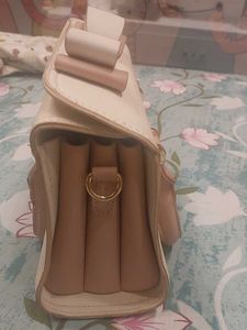 Check out this adorable pastel-colored handbag