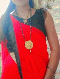 Elegant Red Saree with Black Embellishments