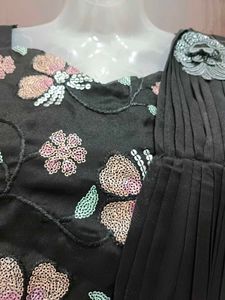 Elegant Black Saree with Floral Details And Belt