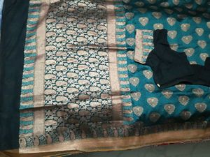 Embellished Banarasi Saree With Patterned Blouse.