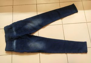 Skinny Blue Jeans With Distressed Pattern