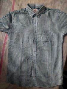 A Shirt Of Medium Size In Blue Colour