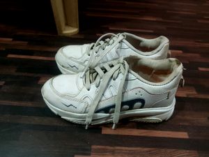 2 Pair Of White Shoes