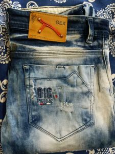 Distressed Blue Denim Jeans