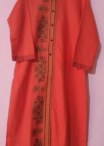 Dark peach color top with foil prints in the middle