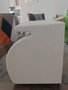 white tissue holder with flat storage on top