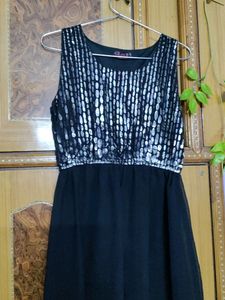 Black slip dress, ankle length.