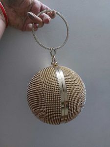 Round Studded Handheld Clutch With Metal Sling