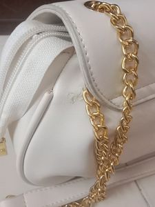 Brand New small sling with gold slin