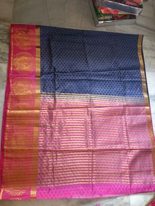 A Pattu Navy Blue nd Pink Coloured Saree.