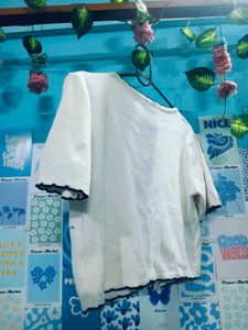 Chic White Cardigan with Black Trim