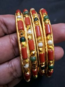 Beautiful coral and gold bangles Sz 2.8