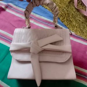 Elegant Pink Handbag with Bow Detail
