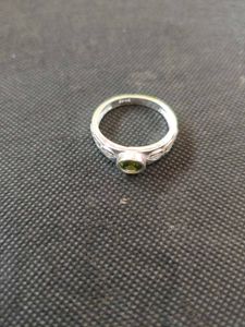 Pure silver ring with green zircon stone.