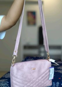 Pink Mochi Sling Bag With Quilted Front And Solid