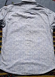 Branded printed leaf print shirt.