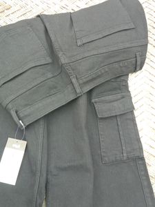 A Black Denim Jeans With 8 Pokets