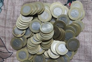 20 Rupees Coins 100 Pcs + 10 RupeesCoins 100pcs.